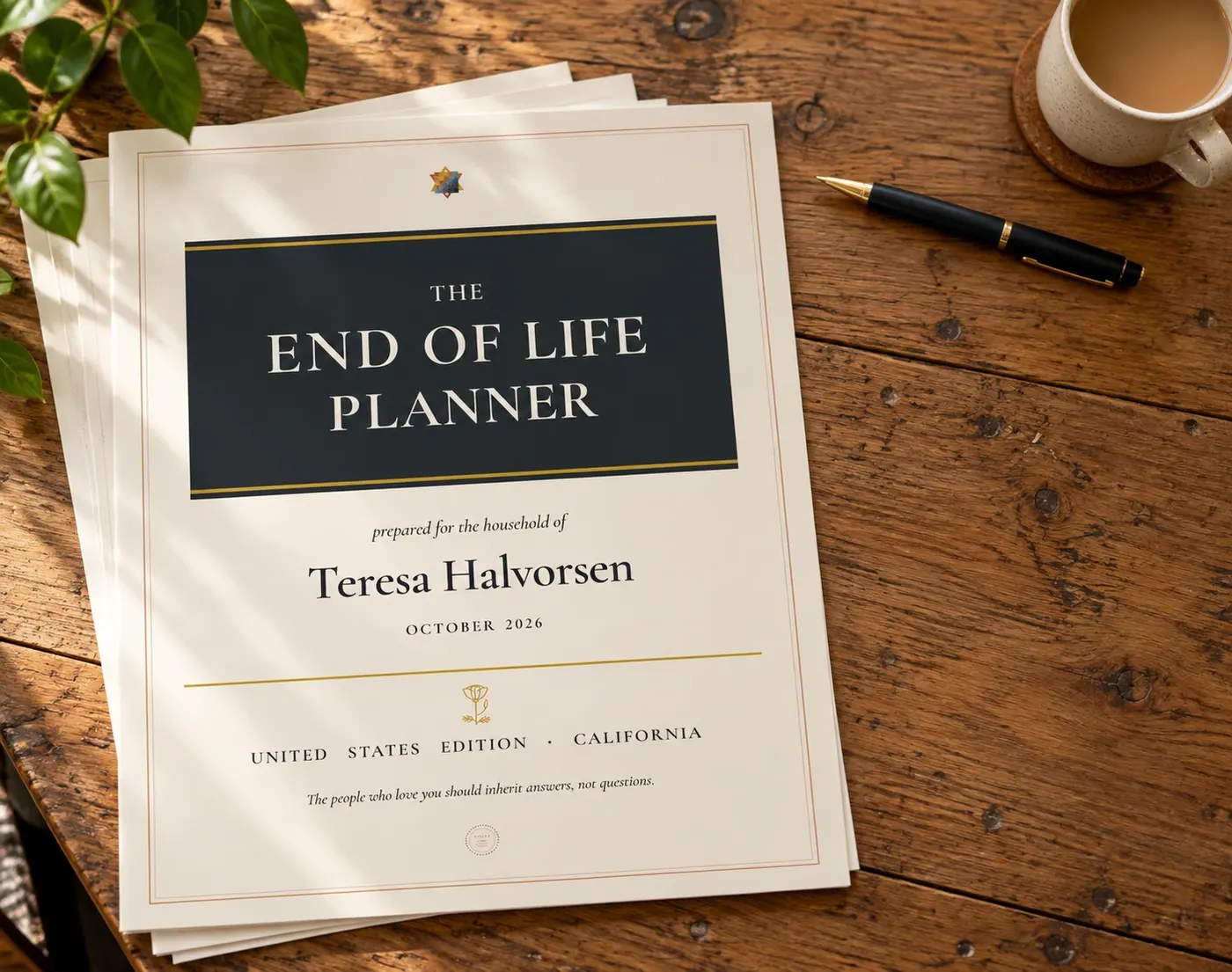 The End of Life Planner's cover, California edition, on a wooden desk beside a fountain pen